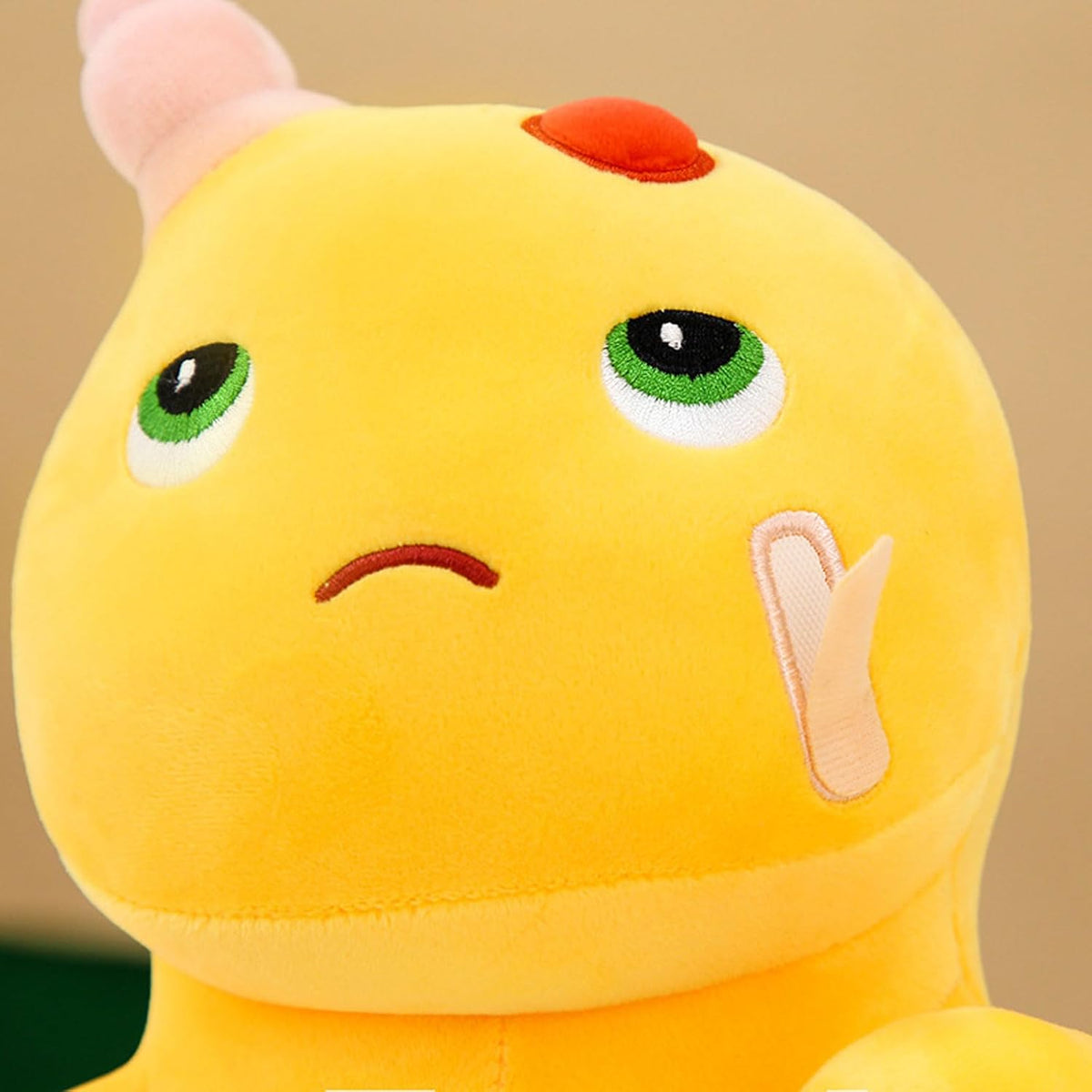 Yellow Dino Plush with Playful Face